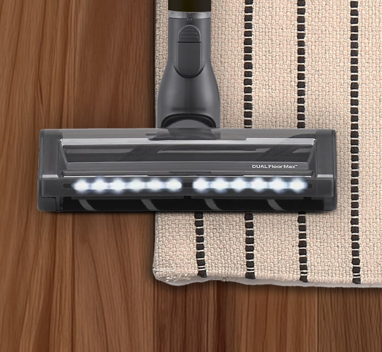 Immagine della spazzola Dual Floor Max su un tappeto e sul parquet